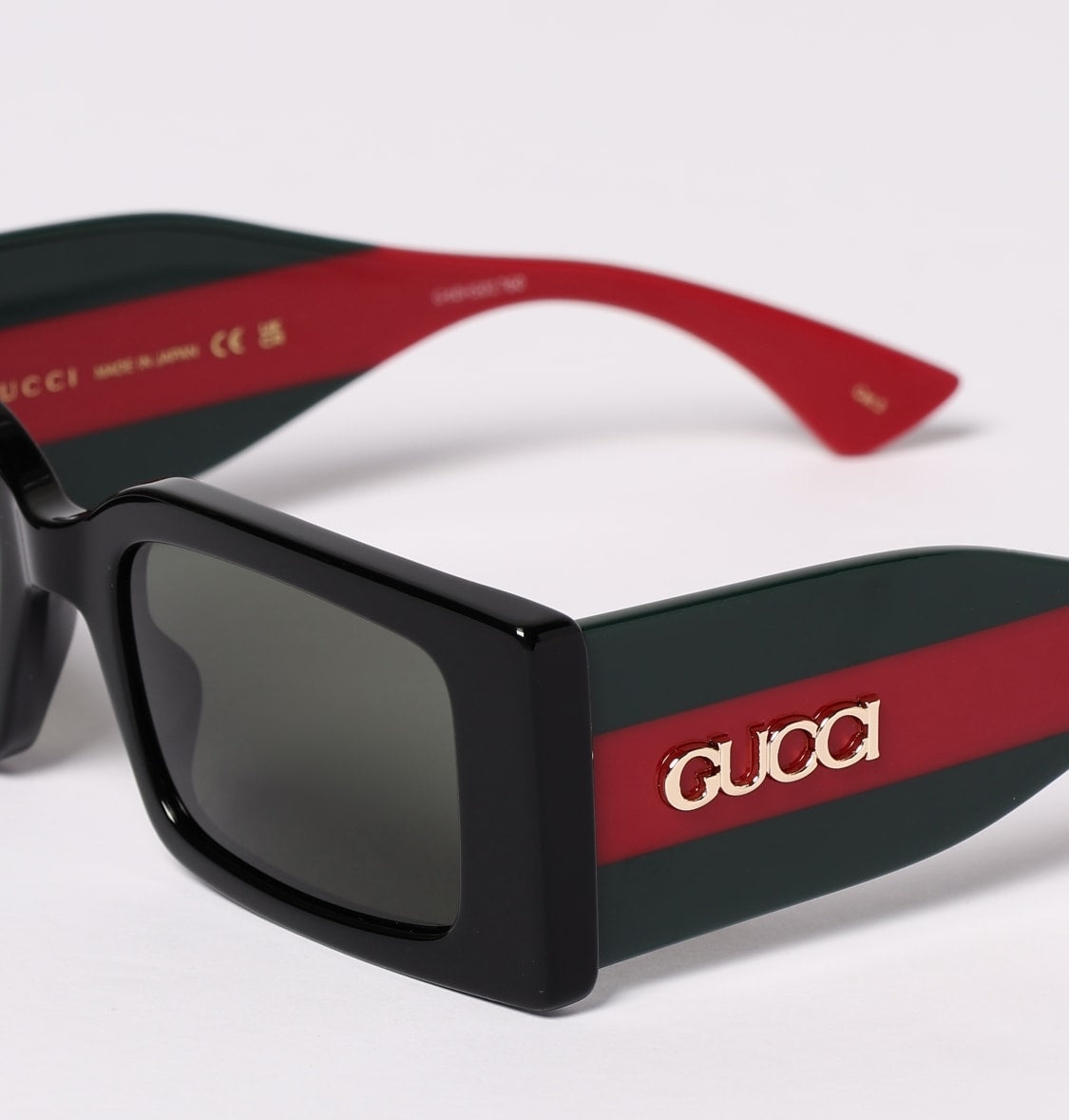 Gucci GG1860S-001 sunglasses in green frame with gray lenses