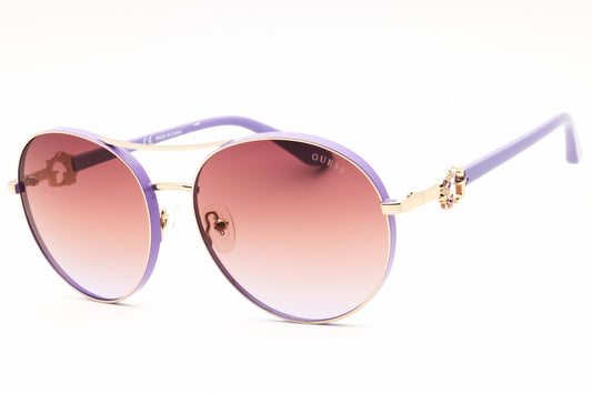 Guess GU7791-S-32Z sunglasses in gold frame with gradient or mirror violet lenses